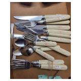 Collection of Vintage Kitchen Utensils, Cutlery, and Wooden Napkin Rings