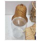 Assorted Woven Basketry Decor Items, Hand Fan, and Floral Arrangement