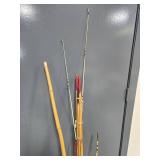 Collection of Vintage and Modern Fishing Rods with Reels in Bucket