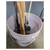 Collection of Vintage and Modern Fishing Rods with Reels in Bucket
