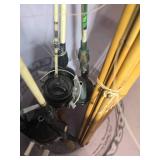 Collection of Vintage and Modern Fishing Rods with Reels in Bucket