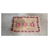 Set of Shaw Living Novelty Doormats and 3-Tier Brown Wicker Storage Rack