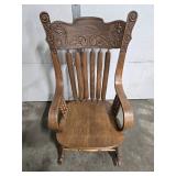 Antique Wooden Rocking Chair with Ornate Carved Back and Arms