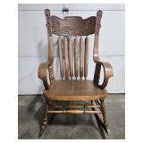 Antique Wooden Rocking Chair with Ornate Carved Back and Arms