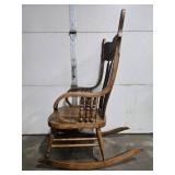 Antique Wooden Rocking Chair with Ornate Carved Back and Arms