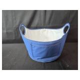 Holiday Partyware Lot with White Plastic Tubs, Blue Storage Basket, Plates, Napkins, and Cinnamon Candle