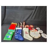 Holiday Decor and Party Supplies Lot with Stockings, Ornaments, Napkins, and Tablecovers