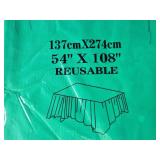 Holiday Decor and Party Supplies Lot with Stockings, Ornaments, Napkins, and Tablecovers