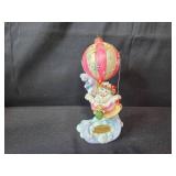 Christmas Holiday Decor Collection with Dreamscicles Figurine, Hello Cucumber Music Box, Santa Hat, and Party Supplies