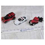 Toy vehicles including a Tonka vintage car, a Chevrolet police car, and a J.T. Wilson truck