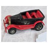 Toy vehicles including a Tonka vintage car, a Chevrolet police car, and a J.T. Wilson truck