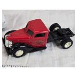 Toy vehicles including a Tonka vintage car, a Chevrolet police car, and a J.T. Wilson truck