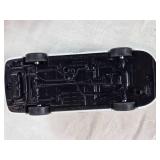 Toy vehicles including a Tonka vintage car, a Chevrolet police car, and a J.T. Wilson truck