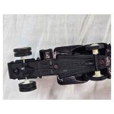 Toy vehicles including a Tonka vintage car, a Chevrolet police car, and a J.T. Wilson truck