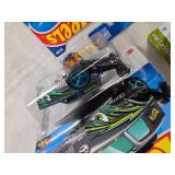 Hot Wheels Assorted Die-Cast Cars featuring different models and themes such as Netflix
