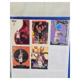 Binder of Sports Cards Featuring Basketball and Baseball Players Including Michael Jordan and Ken Griffey Jr. Various cards from different sets