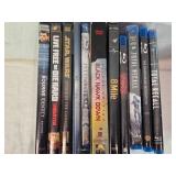 Mixed media collection including DVDs and Blu-rays with titles such as The Bourne Identity, Live Free or Die Hard, Star Wars: Attack of the Clones and Others