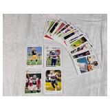 Lot of 4 Football Cards Featuring Brett Favre, Emmitt Smith, Wayne Chrebet, and Jevon Kearse