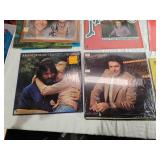 Variety of vinyl records featuring notable country and pop artists such as Sam & Kirk McGee, Del Shannon, Carl Smith, Mel Tillis, Marty Robbins, The Carpenters, Johnny Duncan, Mickey Gilley, Charlie R