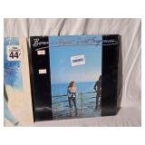 Cher and Bonnie Raitt Vinyl Records including Greatest Hits, Sweet Forgiveness, and Half-Breed Albums