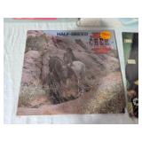 Cher and Bonnie Raitt Vinyl Records including Greatest Hits, Sweet Forgiveness, and Half-Breed Albums