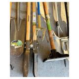 G - Collection of 9 Yard and Garden Tools Including Shovel, Post Hole Digger, Tampers, and Rakes