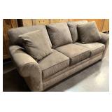 Upholsters Sleeper Couch with tags still on it