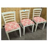 3 solid white wooden chairs with floral seat
