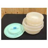 7 Tupperware containers with 5 lids