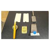 two Cheese graders, two Egg dishes, slicer, and press