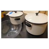 Two pots with lids, strainer, and large plastic bowl
