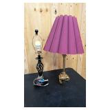 Miss matched table lamps = one black and modern, and the other vintage brass
