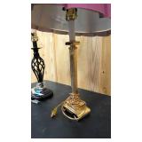 Miss matched table lamps = one black and modern, and the other vintage brass
