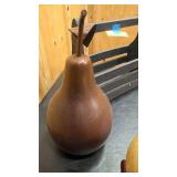 Rustic living décor = small wooden globe, large painted metal pear, and rustic wooden box with handle