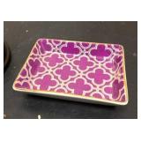 Living room décor = Red cube, clock with globe, and decorative small dish