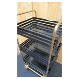 Gold and black rolling metal tea cart 30" tall,  14 wide, and 16.5