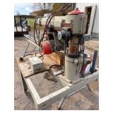 Wood spindle tenonizer. Commercial tenon cutting machinery for log furniture, timber framing, and handrail construction