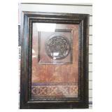 Framed Wall Hanging with an Ornate Metal Medallion Design