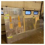 Sheets of metal apear to be Aluminum