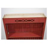 Red Wall-Mount Plate Rack and Ornate Wood Mirror