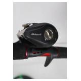 Shakespeare Ugly Stik GX2 Casting Rod with Reel and Green Rod Sleeve