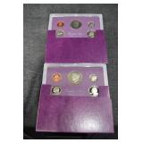 Two 1985s United States Mint 5-Coin Sets - Purple Presentation Wallets
