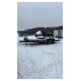 2002 PJ Flatbed equipment trailer with two loa with two loading ramps.