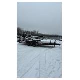 2002 PJ Flatbed equipment trailer with two loa with two loading ramps.