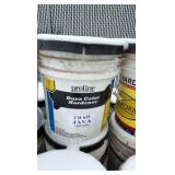 Pallet of buckets of color hardener for concrete