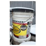 Pallet of buckets of color hardener for concrete