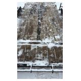 2002 PJ Flatbed equipment trailer with two loa with two loading ramps.