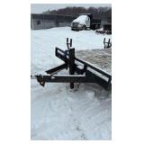 2002 PJ Flatbed equipment trailer with two loa with two loading ramps.