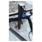 2002 PJ Flatbed equipment trailer with two loa with two loading ramps.