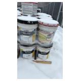 Pallet of buckets of color hardener for concrete